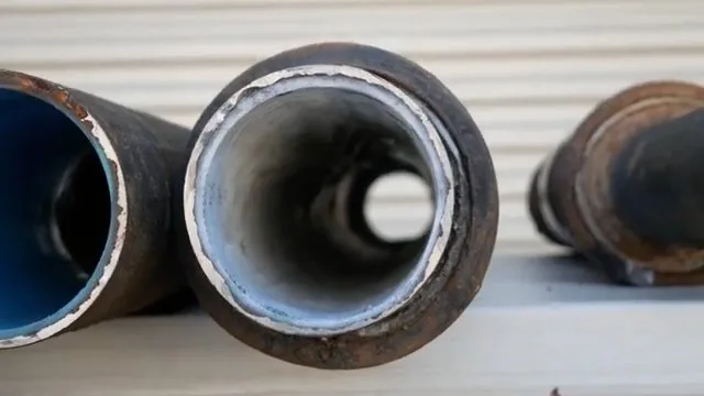 On-site photo of the coupling new lined pipe to old cast iron.
